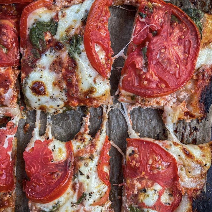 thick and crispy sourdough pizza crust with cheese and tomatoes