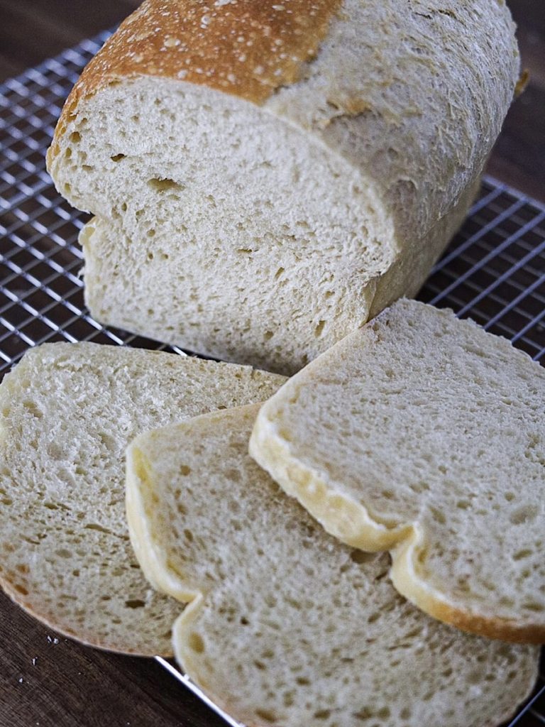 easy crustless sourdough sandwich bread on wire rack cut into 3 slices