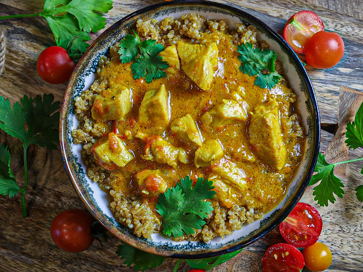 30 Minute Coconut Chicken Curry in bowl with cilantro tomatoes simple is gourmet