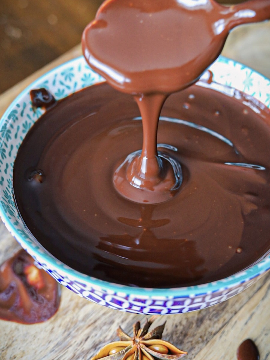 Homemade Healthier Chocolate Syrup Recipe chocolate dripping off spoon