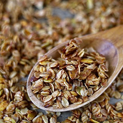 homemade granola on wooden spoon